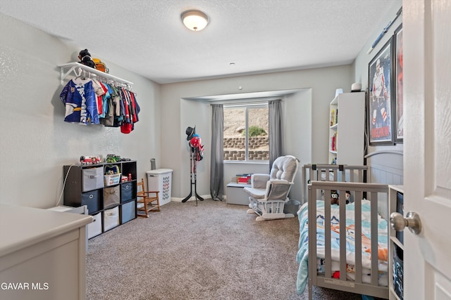 18551 Jacks Hill Rd, Tehachapi, CA 93561 - carpeted bedroom featuring a textured ceiling and a nursery area