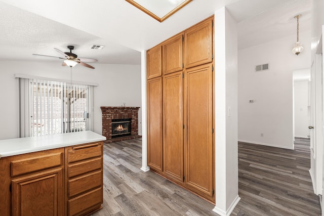 3243 Geri Ct, Rosamond, CA 93560 - kitchen featuring ceiling fan, dark wood-type flooring, baseboards, and light countertops