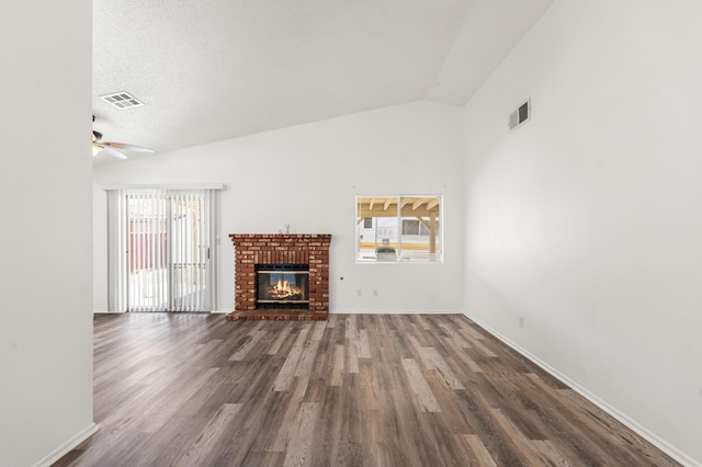 3243 Geri Ct, Rosamond, CA 93560 - unfurnished living room featuring lofted ceiling, ceiling fan, wood finished floors, a fireplace, and baseboards