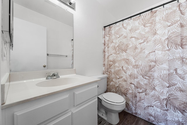 3243 Geri Ct, Rosamond, CA 93560 - full bath featuring toilet, wood finished floors, and vanity