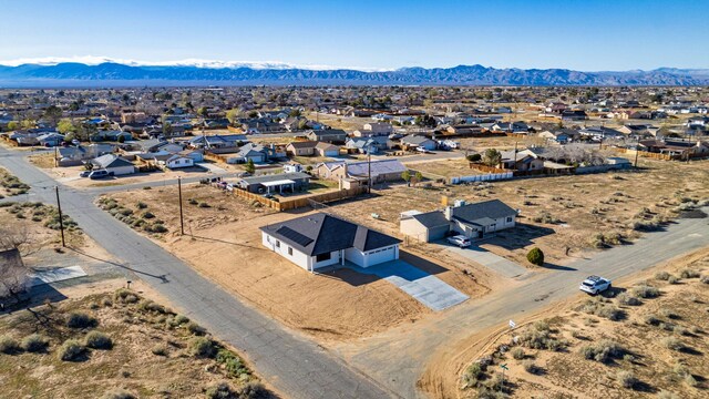 birds eye view of property with a residential view and a mountain view
