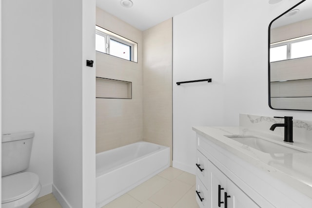 bathroom featuring tile patterned floors, toilet, vanity, and baseboards