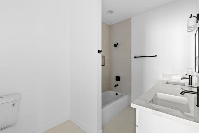 bathroom with toilet, shower / tub combination, double vanity, and a sink