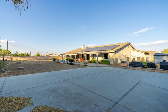 view of front of home featuring solar panels