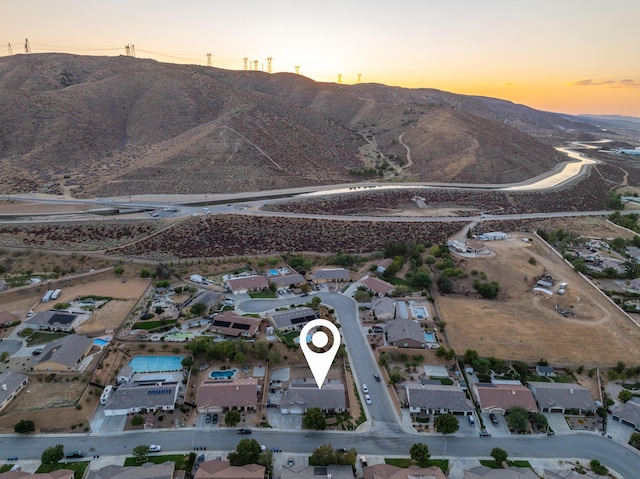 aerial view at dusk with a mountain view