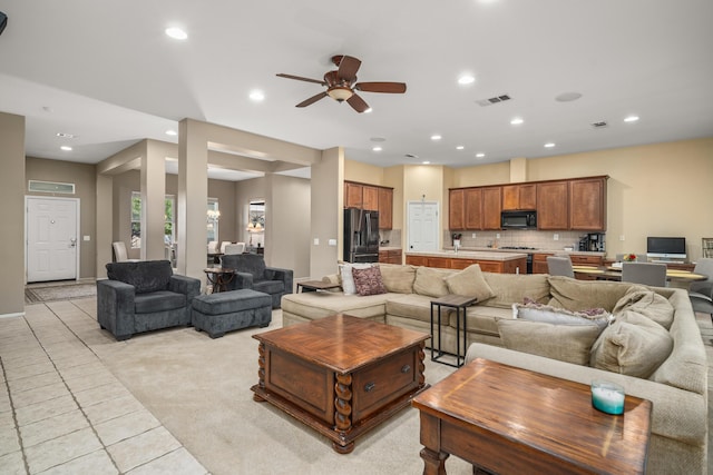 living room with light tile patterned floors and ceiling fan