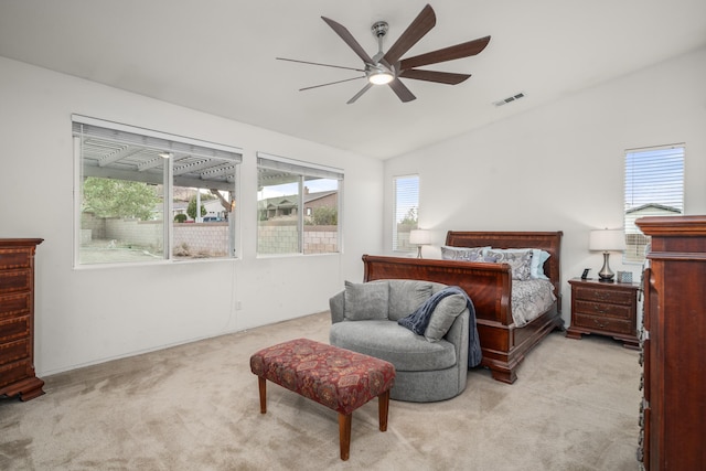 bedroom featuring light carpet, ceiling fan, and lofted ceiling