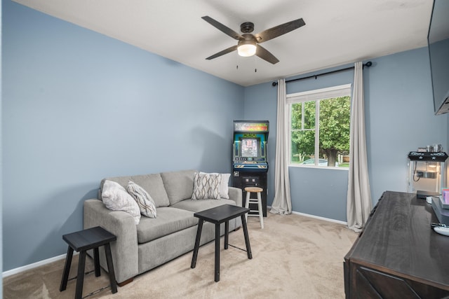 living room with ceiling fan and light colored carpet