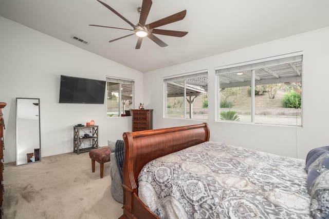 bedroom featuring light carpet, ceiling fan, and lofted ceiling