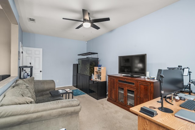 living room with ceiling fan and light colored carpet