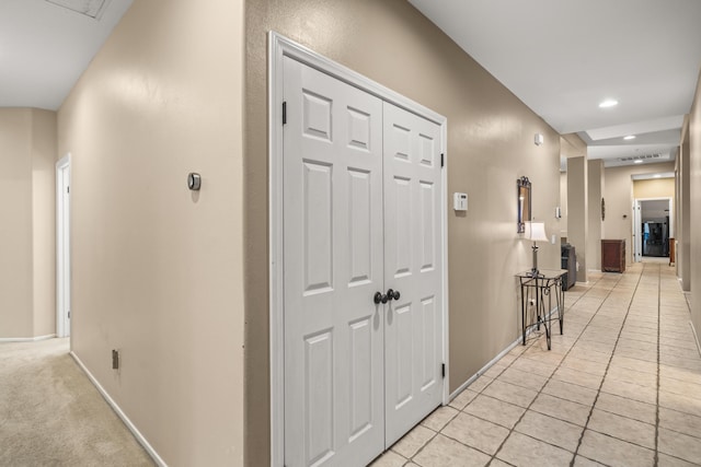 hall with light tile patterned flooring