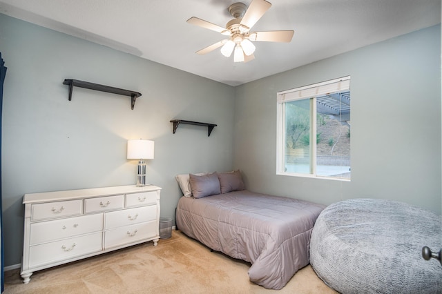 bedroom featuring ceiling fan and light colored carpet