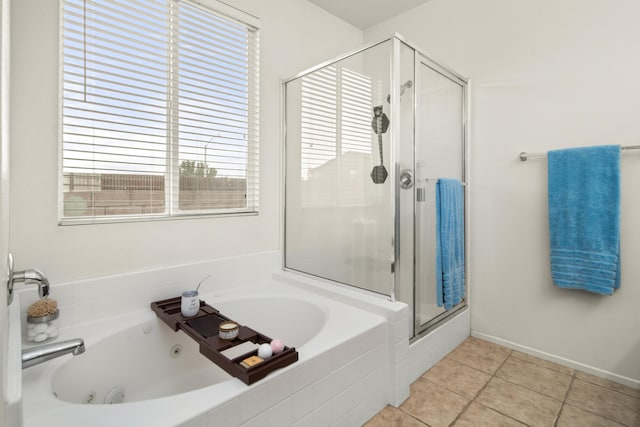 bathroom with separate shower and tub and tile patterned floors