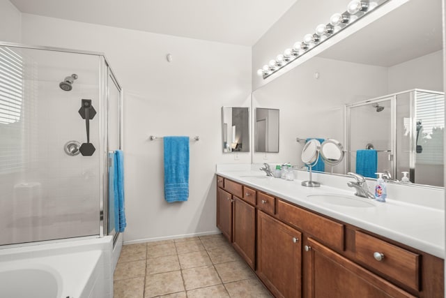 bathroom featuring tile patterned flooring, vanity, and plus walk in shower