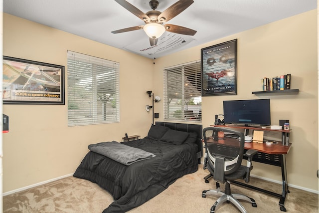 bedroom with ceiling fan and light colored carpet