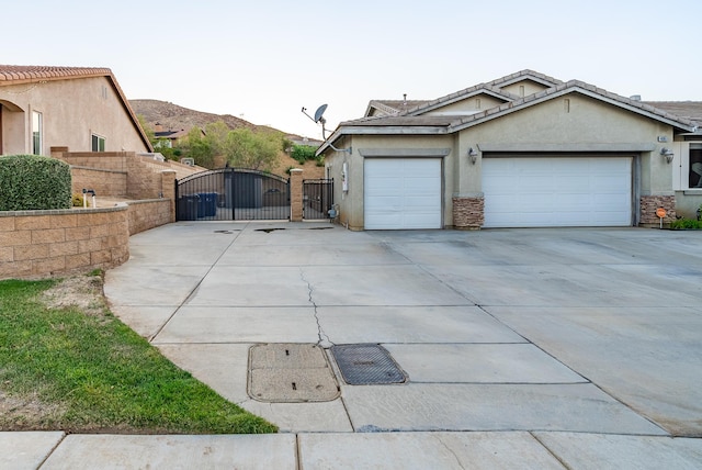 view of property exterior featuring a mountain view and a garage