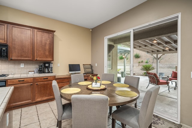 dining room featuring light tile patterned flooring