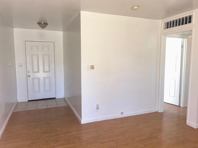 spare room featuring dark hardwood / wood-style floors