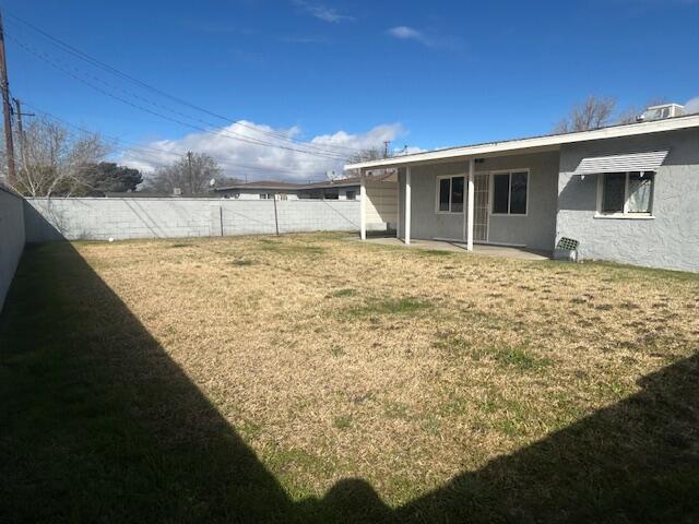 view of yard featuring a patio and a fenced backyard