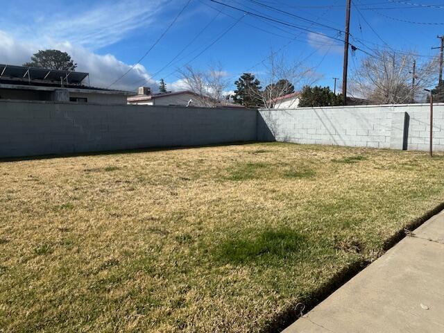 view of yard with a fenced backyard