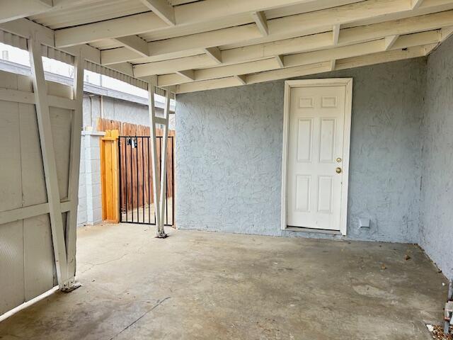 entrance to property with stucco siding