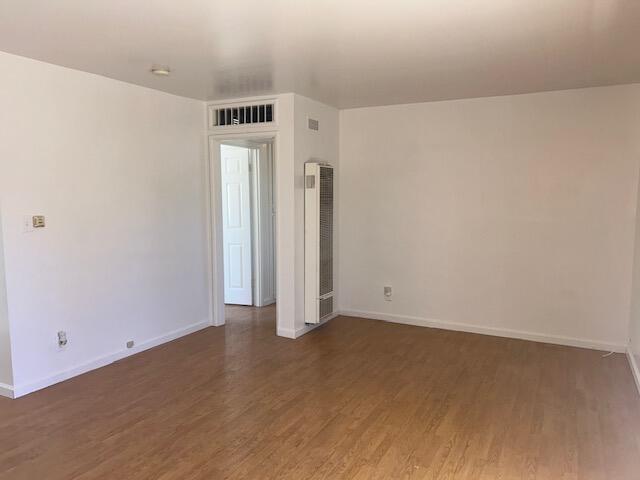 empty room featuring dark hardwood / wood-style floors