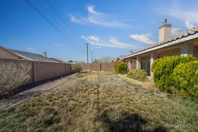 view of yard with a fenced backyard