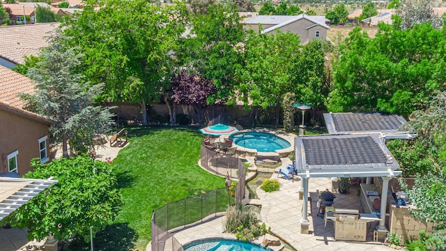 view of pool featuring a patio area and a yard