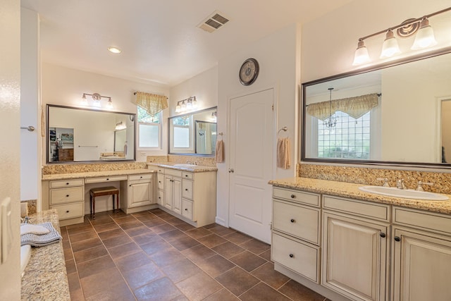 bathroom with vanity and a wealth of natural light