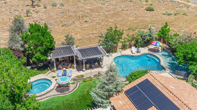 view of pool featuring a patio area and an in ground hot tub