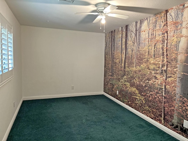 carpeted empty room with ceiling fan