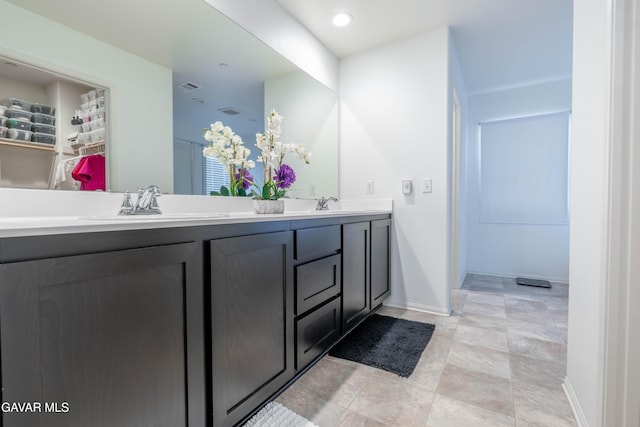 2022 Howard St, Rosamond, CA 93560 - bathroom featuring double vanity and a walk in closet