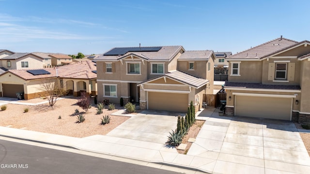 2022 Howard St, Rosamond, CA 93560 - view of front of home with stucco siding, stone siding, and driveway