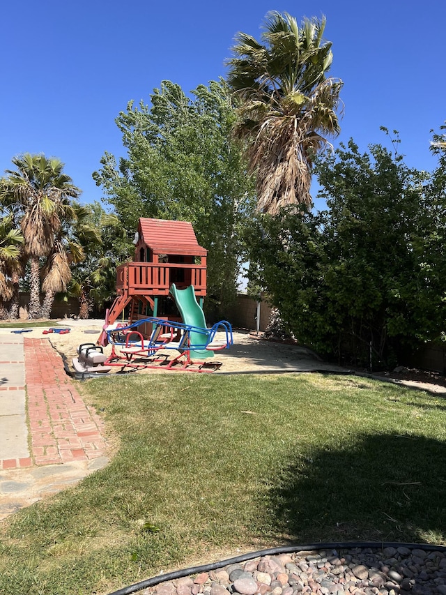 view of play area featuring a lawn