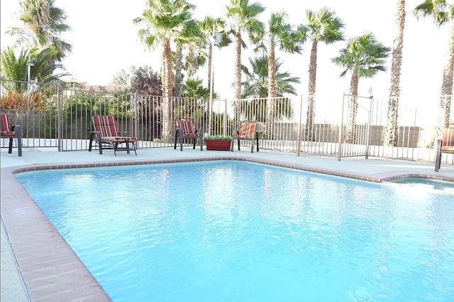 view of swimming pool with a fenced in pool, a patio area, and fence