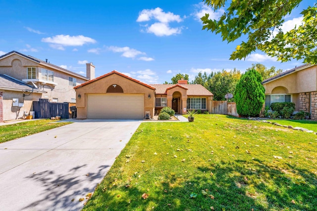 view of front of house with a front yard and a garage