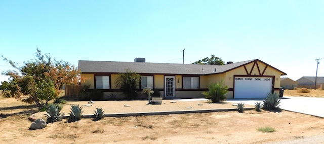 ranch-style house featuring a garage