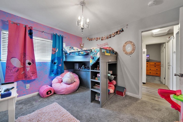 carpeted bedroom with a chandelier, multiple windows, and baseboards