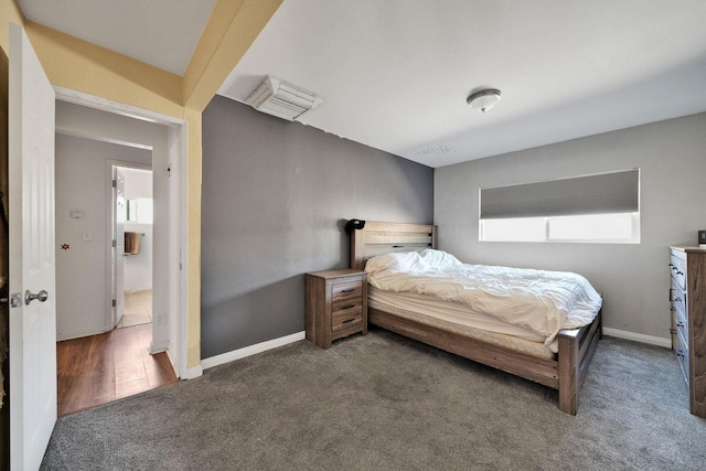 carpeted bedroom with visible vents and baseboards