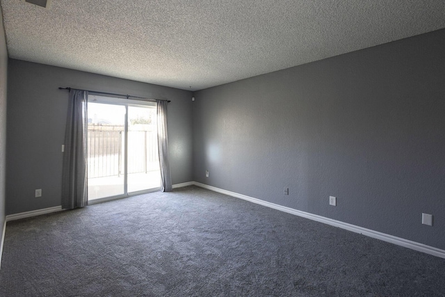 unfurnished room with a textured ceiling, dark colored carpet, a textured wall, and baseboards