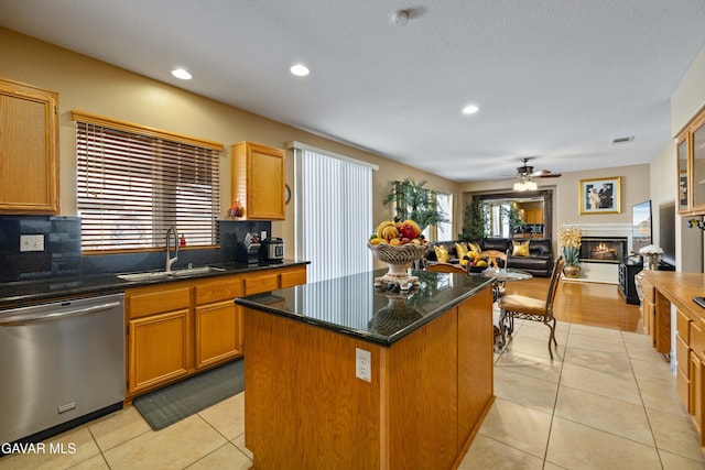 39243 Nicole Dr, Palmdale, CA 93551 - kitchen with stainless steel dishwasher, decorative backsplash, light tile patterned floors, recessed lighting, and a ceiling fan
