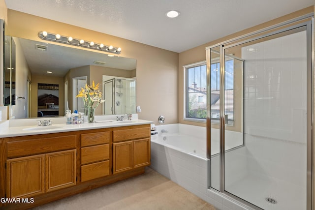 39243 Nicole Dr, Palmdale, CA 93551 - bathroom featuring a shower stall, ensuite bath, a bath, double vanity, and recessed lighting