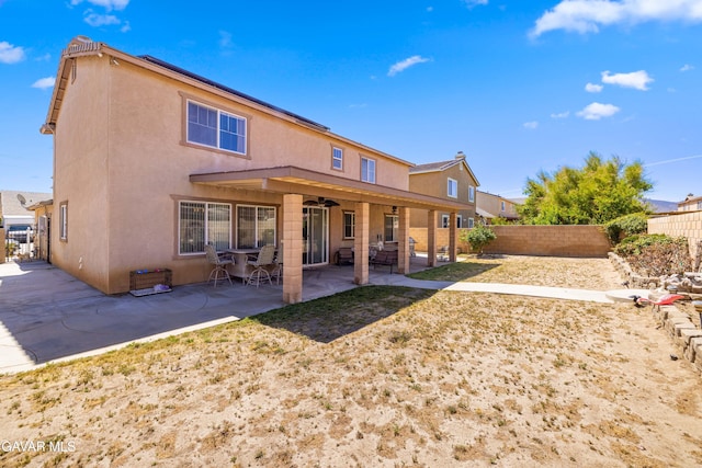 39243 Nicole Dr, Palmdale, CA 93551 - rear view of property featuring a fenced backyard, stucco siding, a patio, and ceiling fan