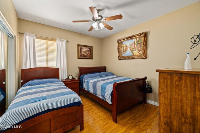39243 Nicole Dr, Palmdale, CA 93551 - bedroom with wood finished floors, ceiling fan, and a closet