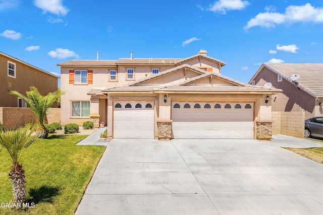 39243 Nicole Dr, Palmdale, CA 93551 - view of front of property with driveway, an attached garage, stucco siding, and stone siding