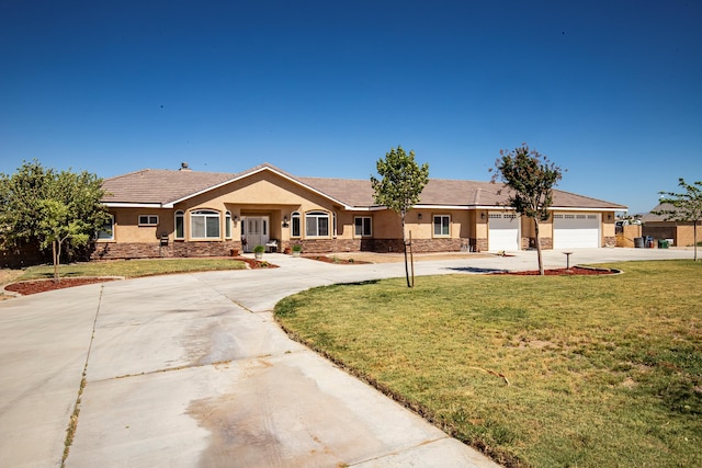 ranch-style home with a garage and a front lawn