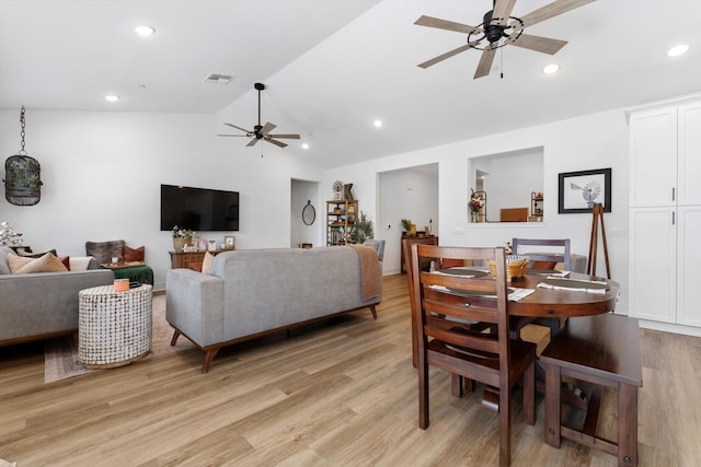 living area featuring a ceiling fan, lofted ceiling, light wood finished floors, and recessed lighting