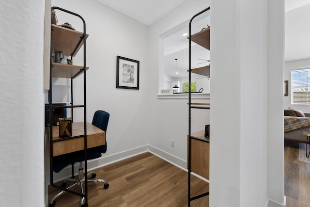 office area featuring wood finished floors and baseboards