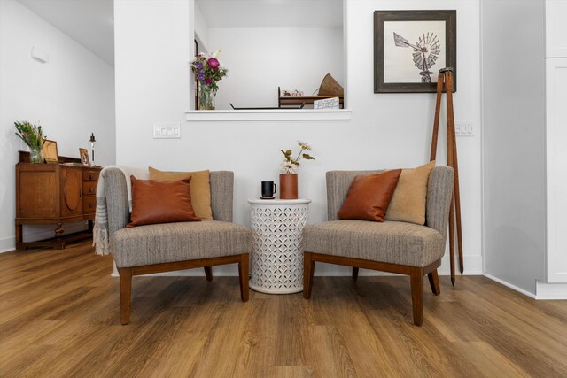 sitting room featuring wood finished floors and baseboards