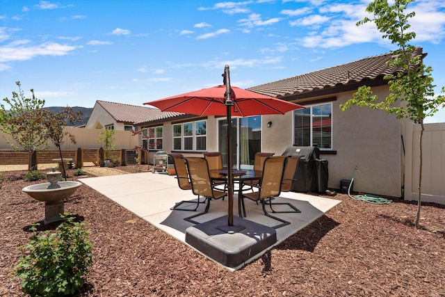 view of patio featuring a grill